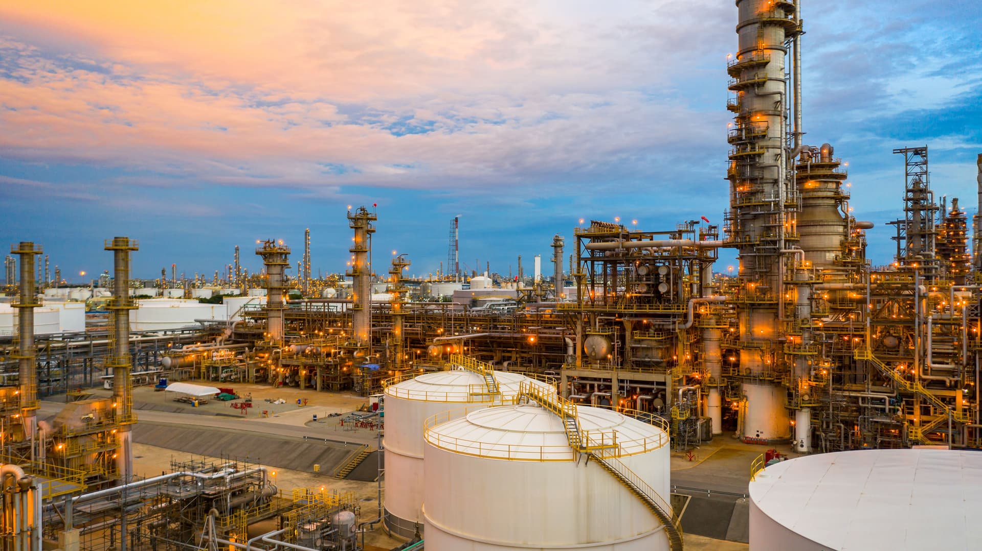 Oil refinery at twilight, aerial view petrochemical plant and oil refinery plant
