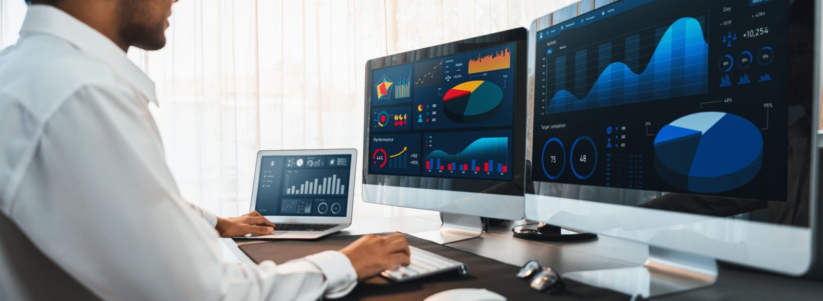 Analyst working on data analysis BI dashboard on computer monitor.Trailblazing