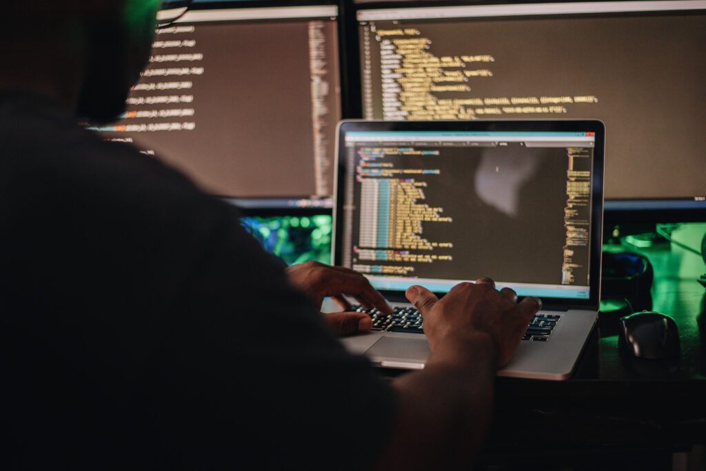 Man doing coding in dark