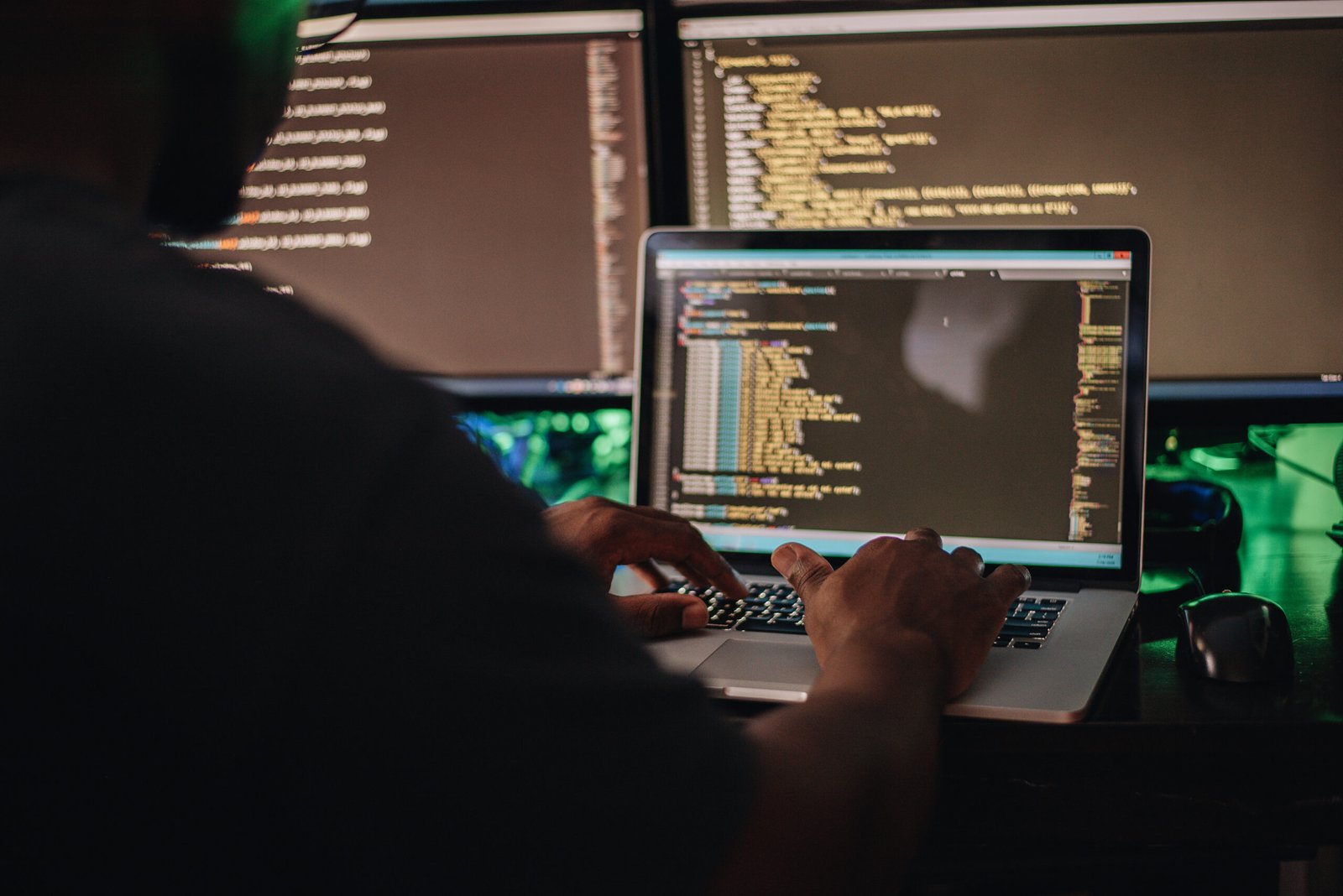 Man doing coding in dark