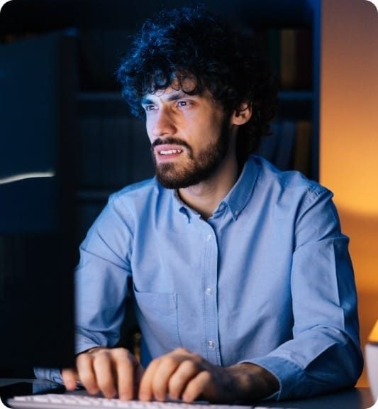 exhausted-freelancer-watching-monitor-working-typing-keyboard-drinking-hot-coffee 3 Web Scraping Services